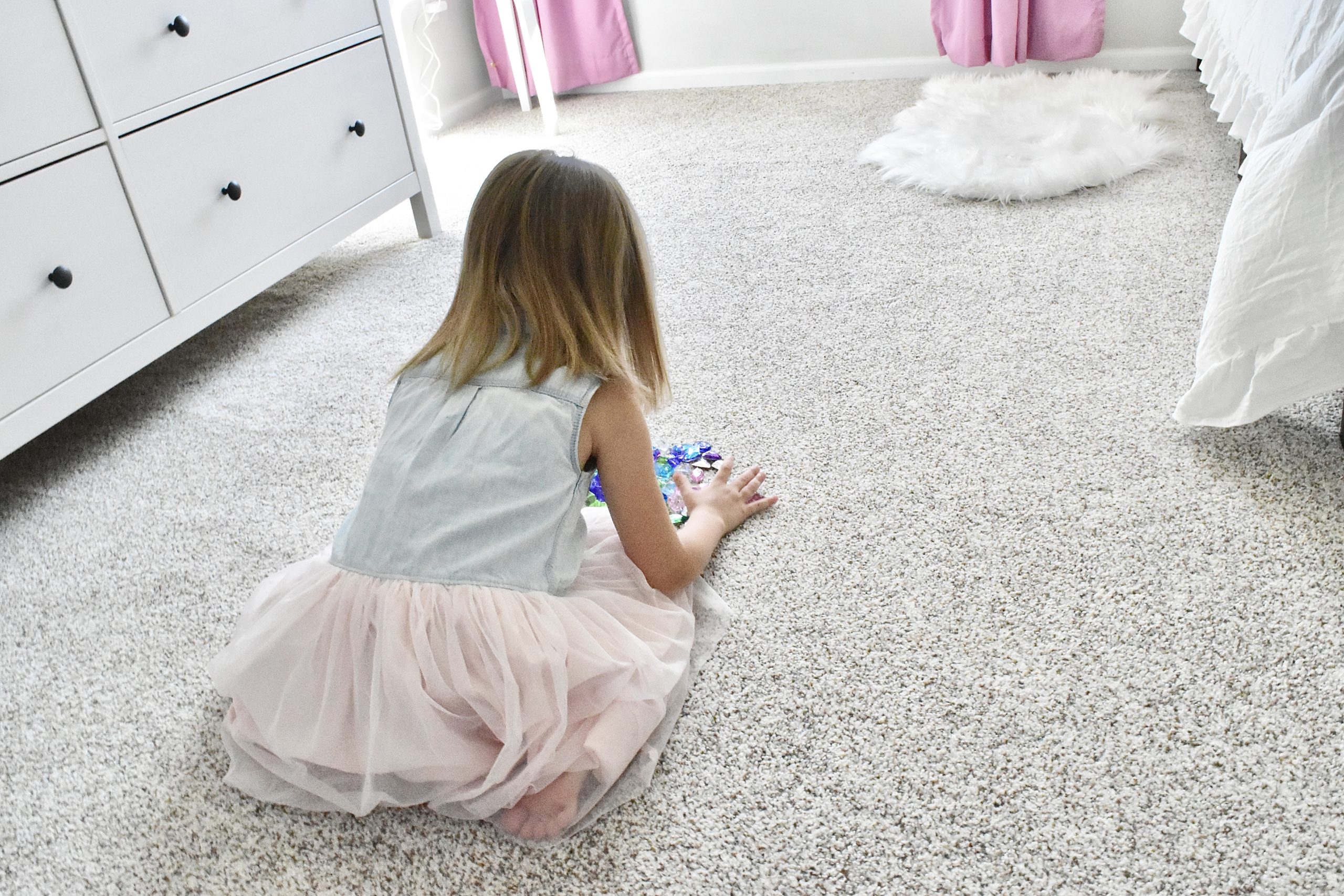 Toddler Girl Playing on Carpet