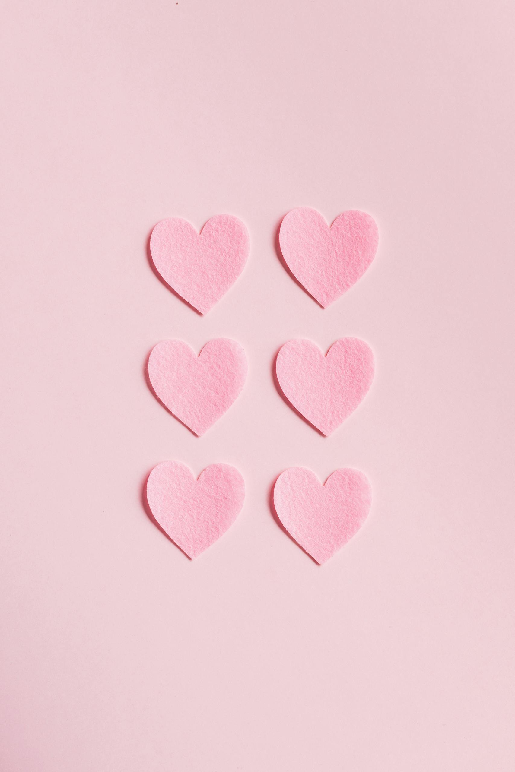 Heart Shaped Cutouts on Pink Background